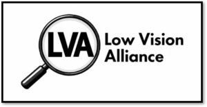 A black and white logo with a depiction of a round handheld magnifier with its handle pointing down diagonally to the left , displaying the letters LVA capitalized in bold black font within the magnifying glass. To the right, are two lines of text in smaller black font, on the first line are the words a low vision and on the second line the word alliance.